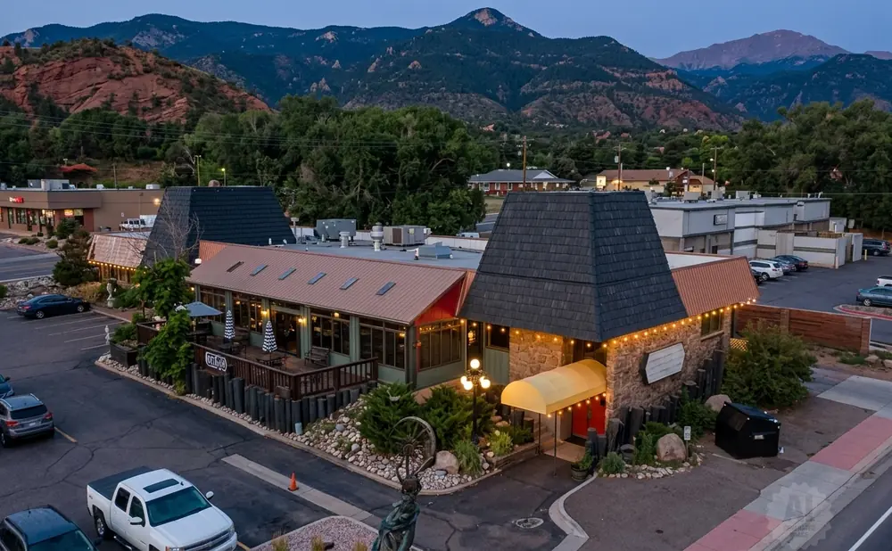 Restaurant building with mountains in the background.