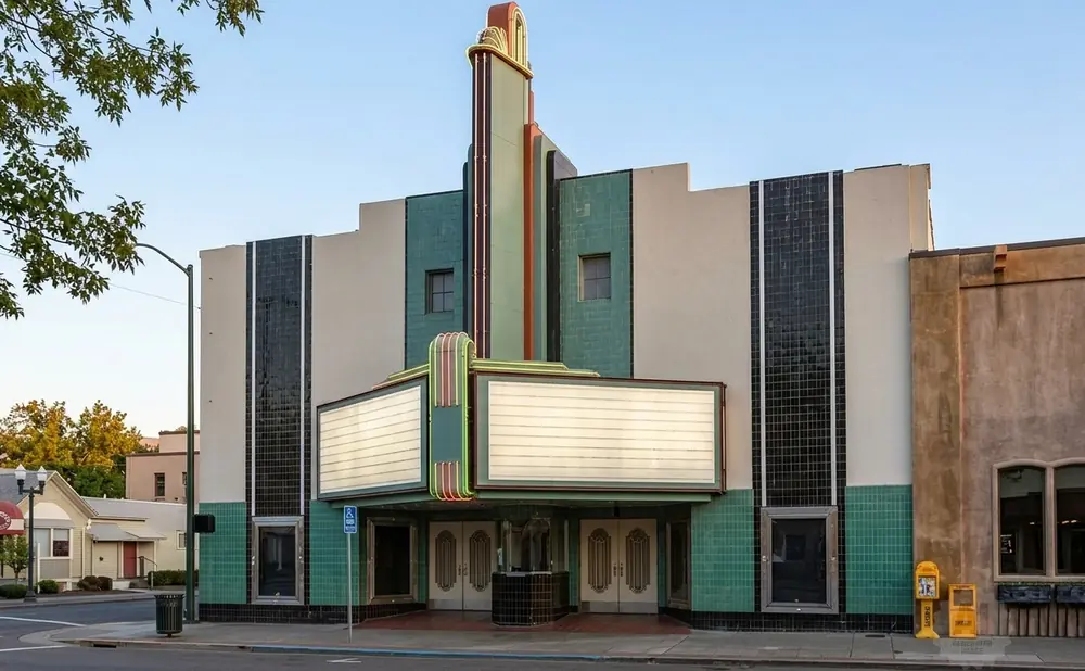 Art deco theater with marquee and colorful vertical accents.
