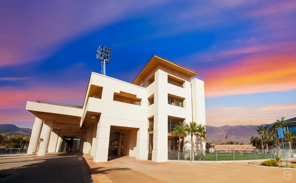 an exterior promotional venue picture of alex g spanos stadium with a sunset sky