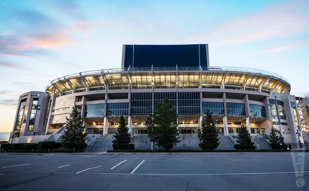 an exterior promotional venue picture of beaver stadium with a sunset sky