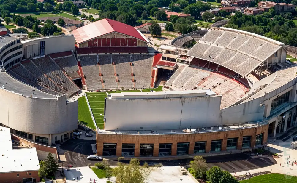 an exterior promotional venue picture of camp randall stadium with a sunset sky