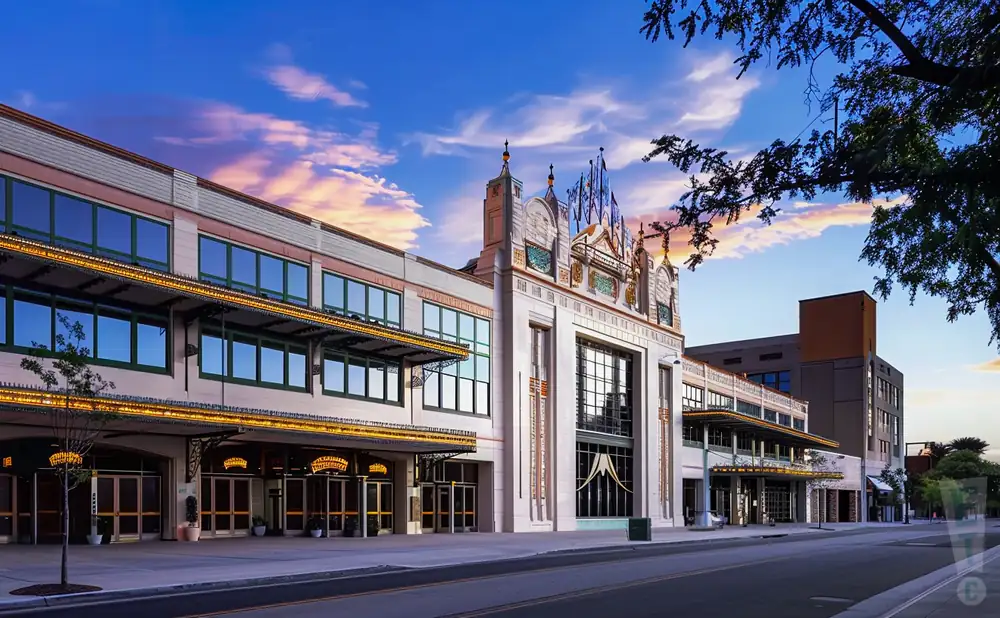 an exterior promotional venue picture of coronado performing arts center with a sunset sky