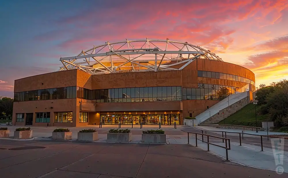 a photograph of crown coliseum at the crown center in fayetteville, north carolina, captured at sunset.  