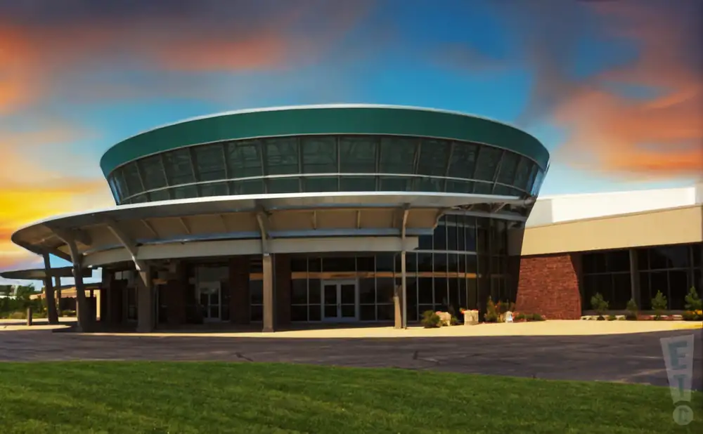 an exterior promotional venue picture of dow arena at dow event center with a sunset sky