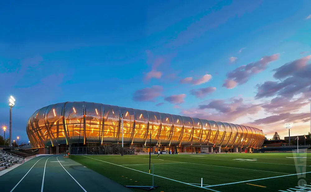 an exterior promotional venue picture of hayward field with a sunset sky,