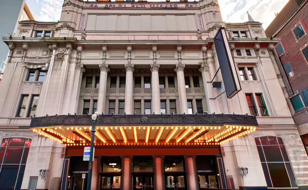 an exterior promotional venue picture of keybank state theatre with a sunset sky