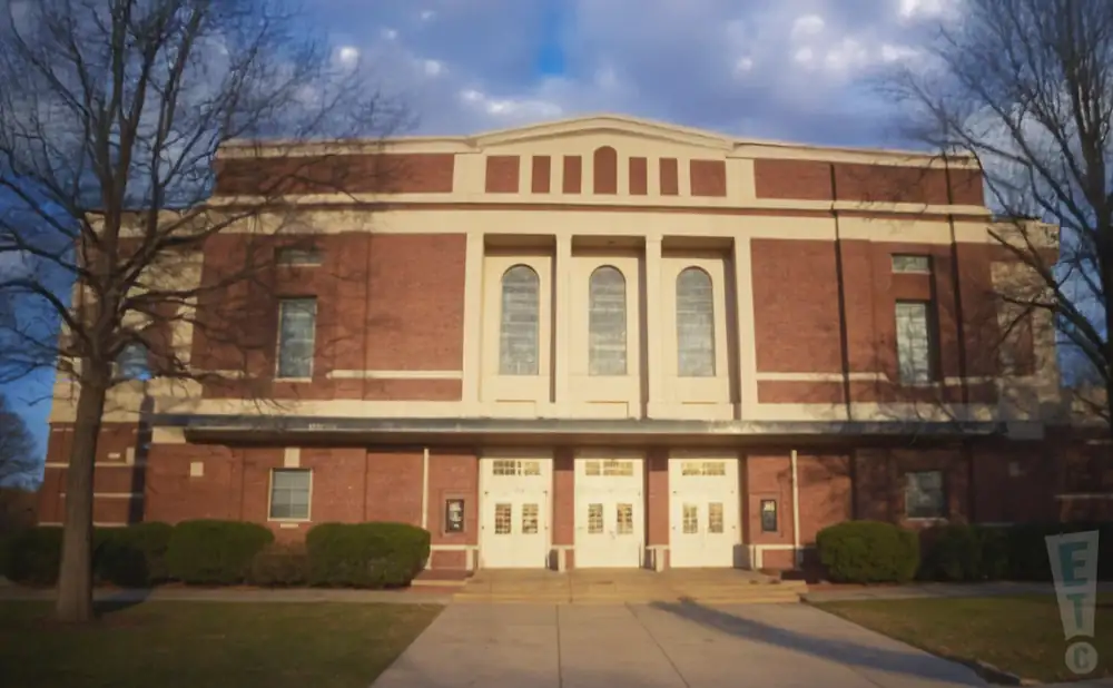 an exterior promotional venue picture of la porte civic auditorium with a cloudy sky
