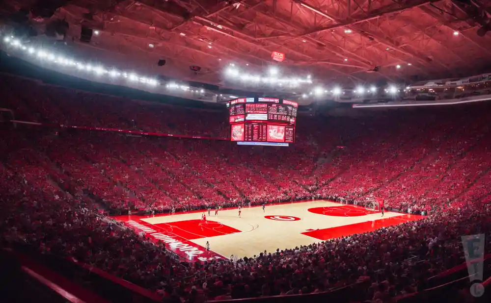 a realistic image of the basketball court at mullins center