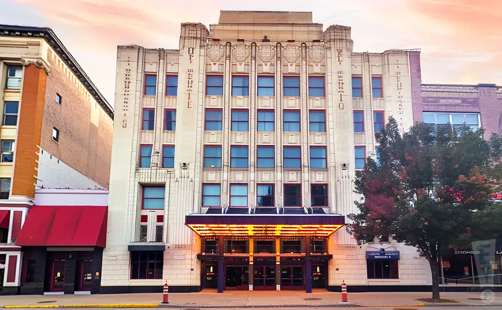 an exterior promotional venue picture of orpheum theatre sioux city with a sunset sky