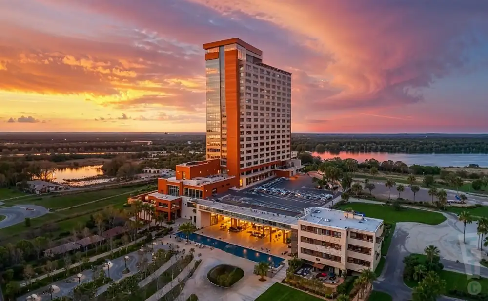 a photograph of paradise cove at river spirit in tulsa, oklahoma, captured at sunset. 