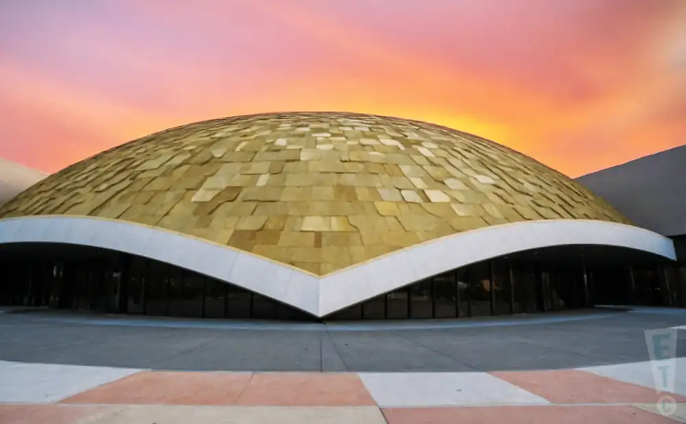 an exterior promotional venue picture of pioneer center for the performing arts with a sunset sky