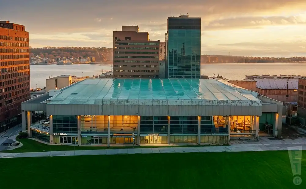 a photograph of the scotiabank centre in halifax, nova scotia, captured at sunset. 