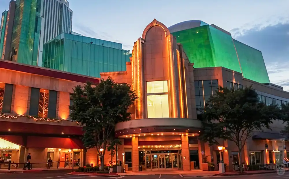 an exterior promotional venue picture of silver legacy casino with a cloudy sky