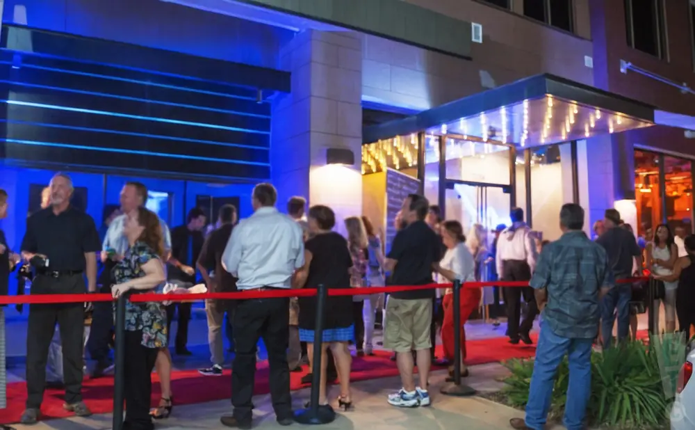 an exterior promotional venue picture of the plano house of comedy during a cloudy day 