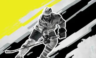 A hockey player in black and white on a yellow and black background.