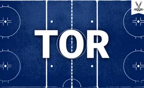 An overhead view of a blue hockey rink with white markings, featuring a central face-off circle and two corner face-off circles.