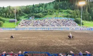 Two cowboys in the arena at Steamboat Springs Pro Rodeo Series