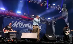 Band performing on stage with 