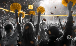 Fans cheer with yellow pom-poms amidst falling confetti at a sporting event.