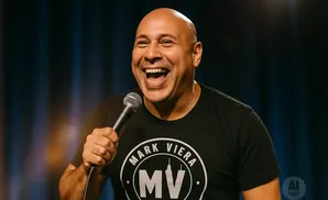 A bald man in a black t-shirt with a 