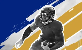 A black and white illustration of a football player in uniform, holding a football.