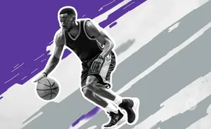 A basketball player dribbles the ball with a purple and grey abstract background.