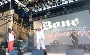 Rappers perform on stage at a concert with 