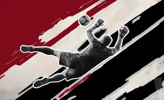A soccer goalie dives to catch a ball against a dynamic red and black background.