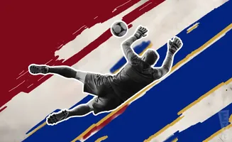 Goalkeeper dives to save a soccer ball against a background of red, white, and blue stripes.