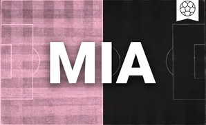 an inter miami cf soccer player kicking the ball down field