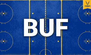 A hockey rink with blue ice and yellow markings, featuring crossed hockey sticks in a yellow banner.