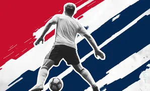 Soccer player in action, kicking a ball against a red, white, and blue abstract background.