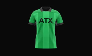 A green and black soccer jersey with 