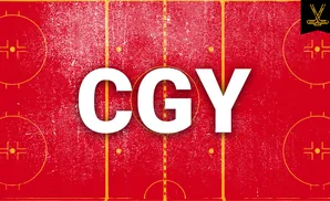 A top-down view of a red hockey rink with yellow markings, a face-off circle, and a hockey stick logo in the top right corner.