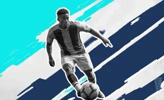 A soccer player dribbles a ball, his body in motion against a blue and white graphic background.
