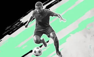 A soccer player dribbles a ball, with abstract black and green brush strokes behind him.