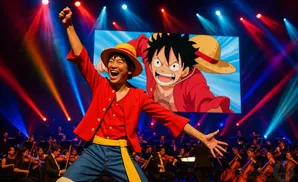 A man dressed as Monkey D. Luffy performs with an orchestra.