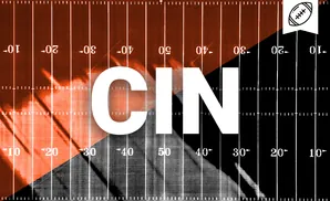 American football field with a diagonal split between orange and black, marked with yard lines and numbers.