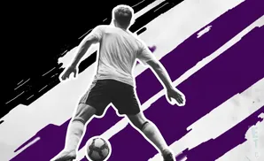 A soccer player in black and white, with purple and black abstract lines in the background.