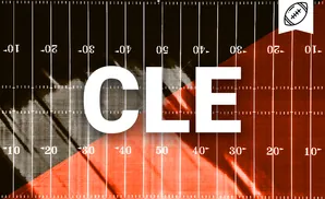 American football field with orange and dark sections, marked with yard lines and numbers.