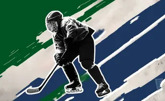 A hockey player in black and white gear skates against a background of green and blue stripes.