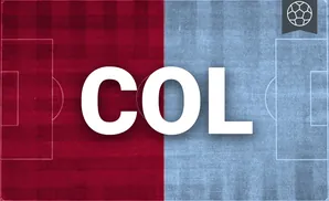 a colorado rapids soccer player kicking the ball down field