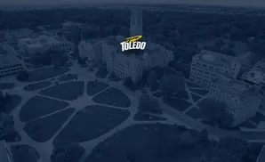 Aerial view of a university campus with the Toledo logo.