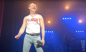 A Freddie Mercury impersonator in a white 