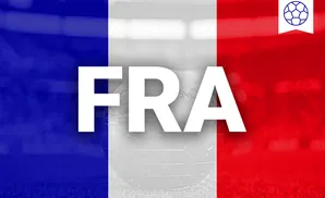 A glass globe with a soccer ball icon against the French flag colors.