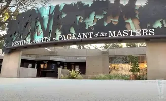 Festival of Arts Pageant of the Masters sign above a building with ticket booths.