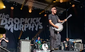 Musicians perform on stage with 