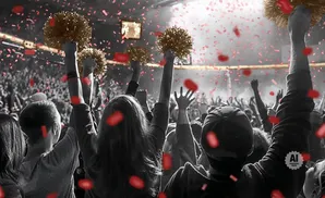 Crowd cheering with pom-poms and red confetti falling.