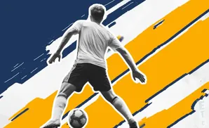 A soccer player in mid-kick with a ball at his feet, set against a backdrop of blue and yellow brushstrokes.