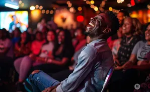 Man laughing hard at a comedy show.